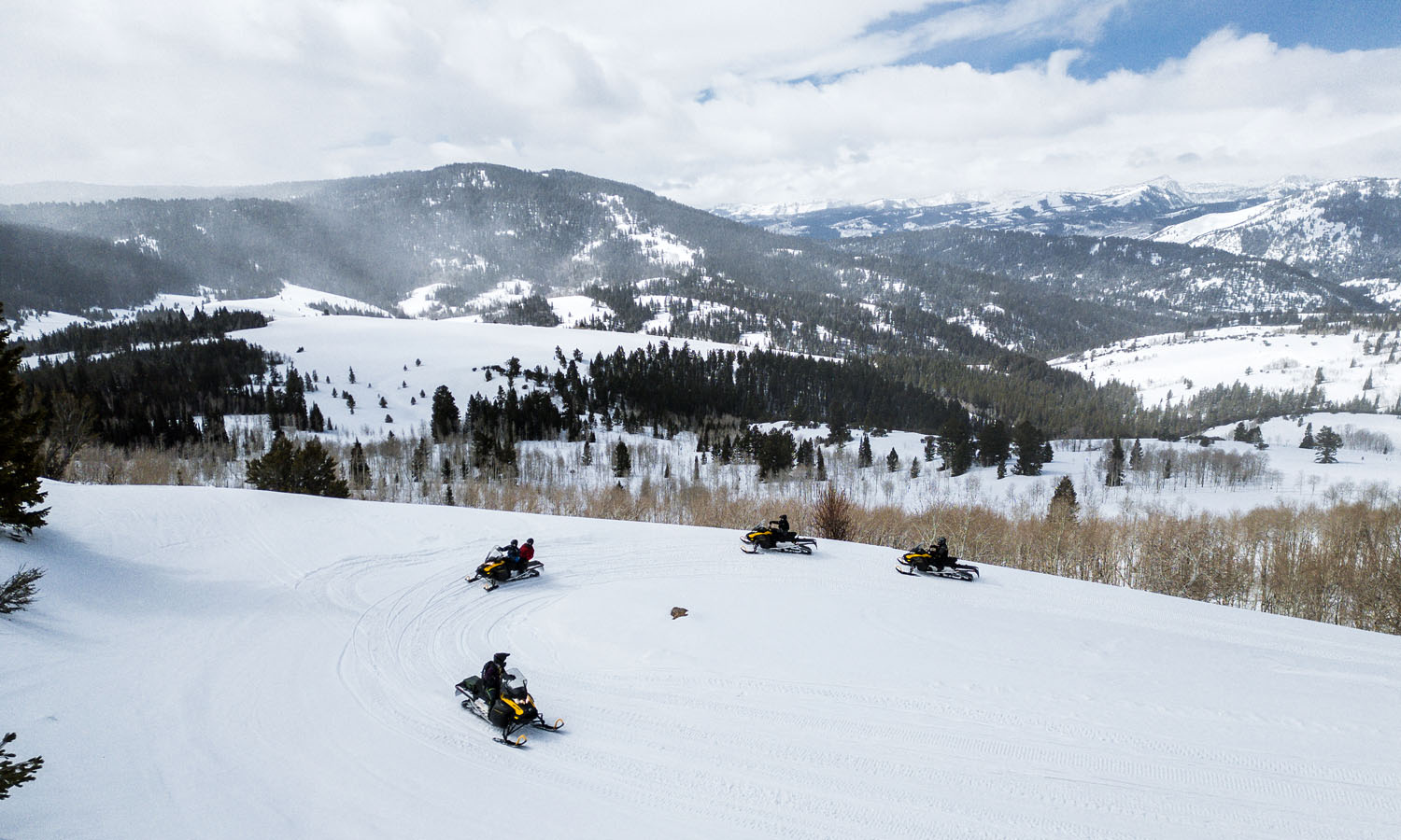 Snowmobilers riding on Bear Lake trails in Utah and Idaho